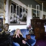 Sylvia Willink at home in Amsterdam.

[keywords]Posed, Half Length, Eyecontact, Sofa, Paintings[/keywords]